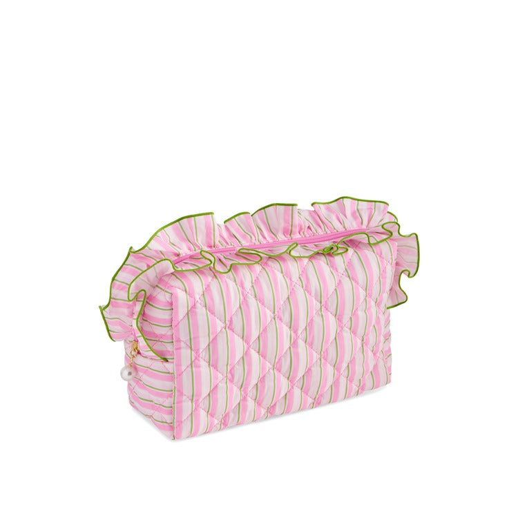 Pink and green striped quilted cosmetic pouch with ruffle trim and zip closure | Walker Boutique