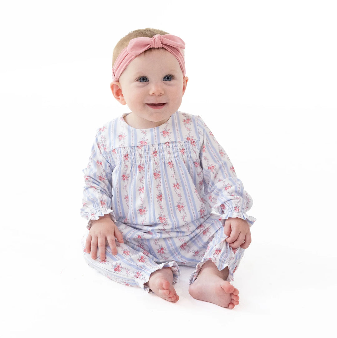 Angel Dear Anna Floral Stripe Smocked Long Sleeve Romper worn by a baby in a lifestyle view highlighting the anna floral stripe smocked design