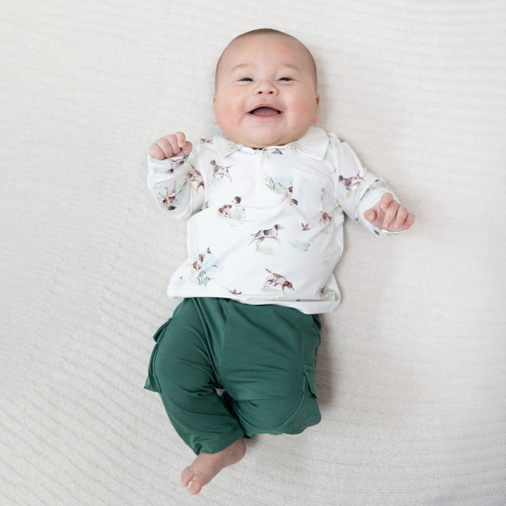 Angel Dear Pointer Pups and Duck Buddies Polo with Cargo Pant worn by a baby in a lifestyle view highlighting the pointer pups and duck buddies polo with cargo pant design