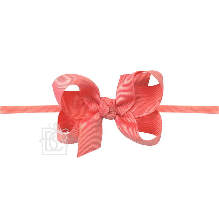 Watermelon bow hair clip on a white background