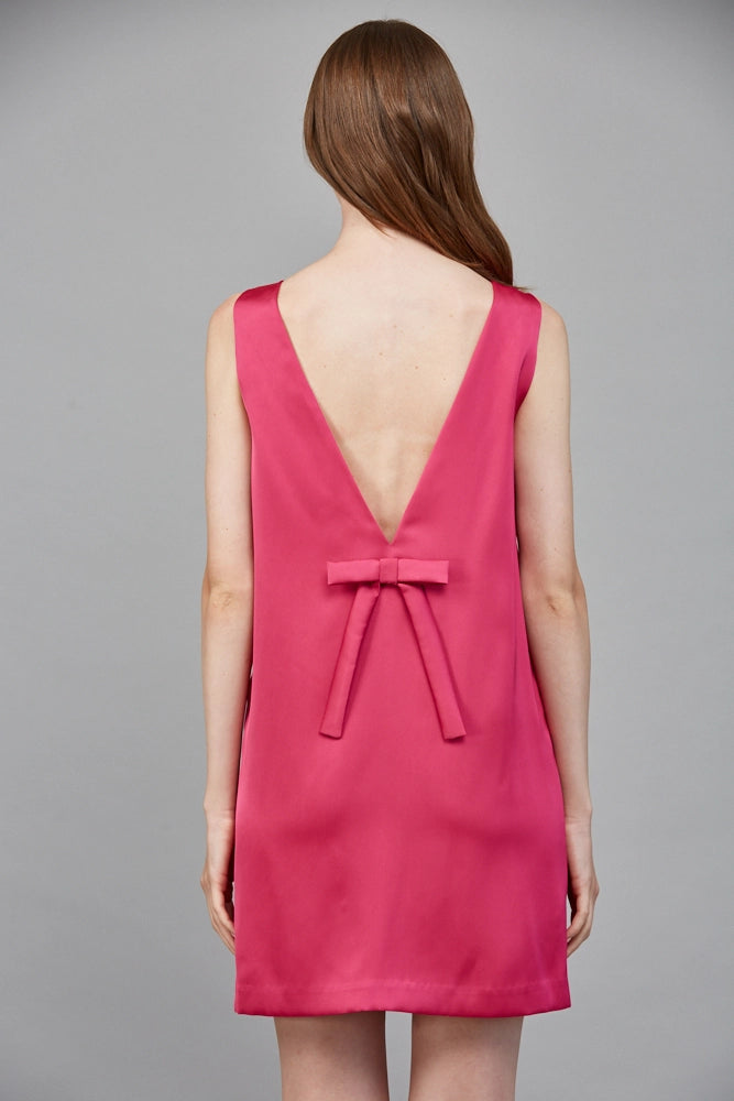 The square neckline and charming bow detail add a touch of elegance, making it perfect for both casual outings and special events.