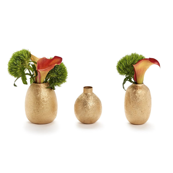 Three gold textured vases with floral arrangements on a white background