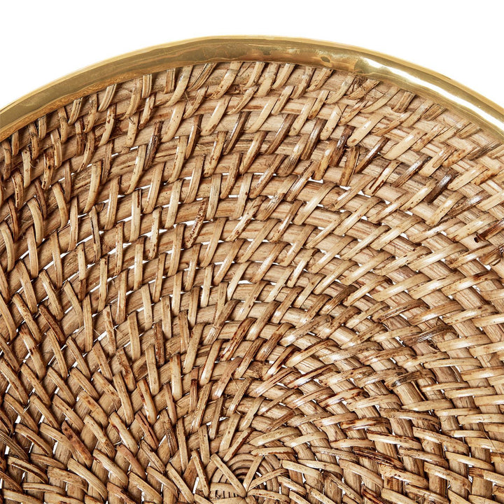 Close-up of a woven rattan surface with a gold rim on a white background