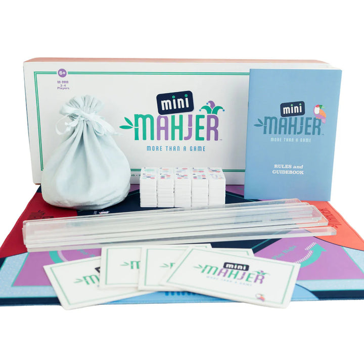 Mini Mahjer game set with colorful game board, tiles, racks, scorecards, rulebook, and storage bag. | Walker Boutique