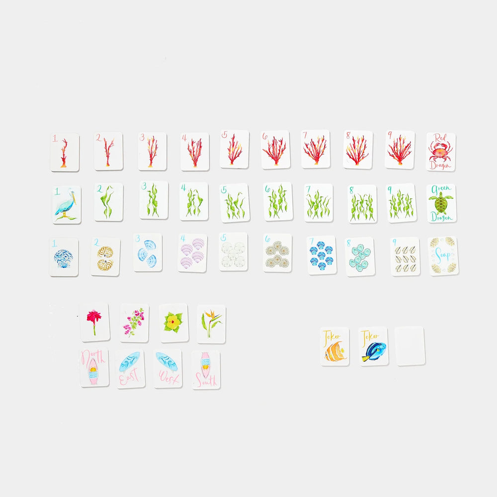 Mini Mahjer coastal-themed playing tiles with seashell, coral, sea life, flower, and joker designs. | Walker Boutique