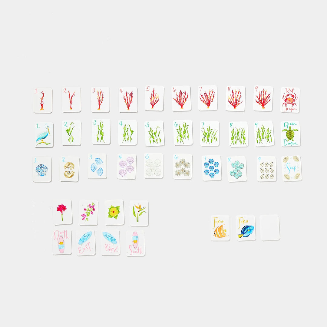 Mini Mahjer coastal-themed playing tiles with seashell, coral, sea life, flower, and joker designs. | Walker Boutique