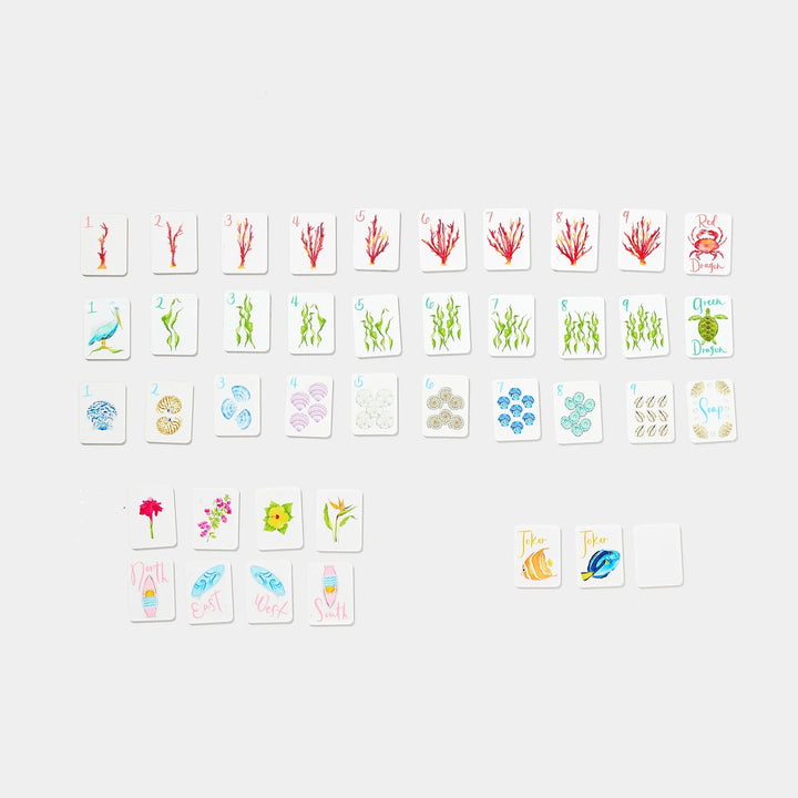 Mini Mahjer coastal-themed playing tiles with seashell, coral, sea life, flower, and joker designs. | Walker Boutique