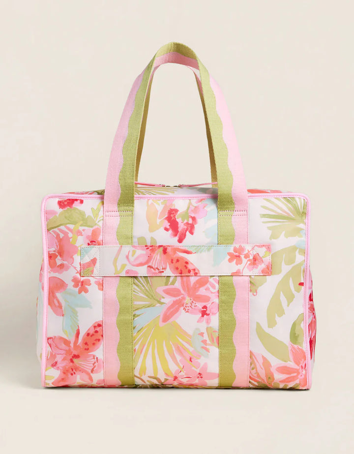 Floral patterned tote bag with pink and green design on a beige background