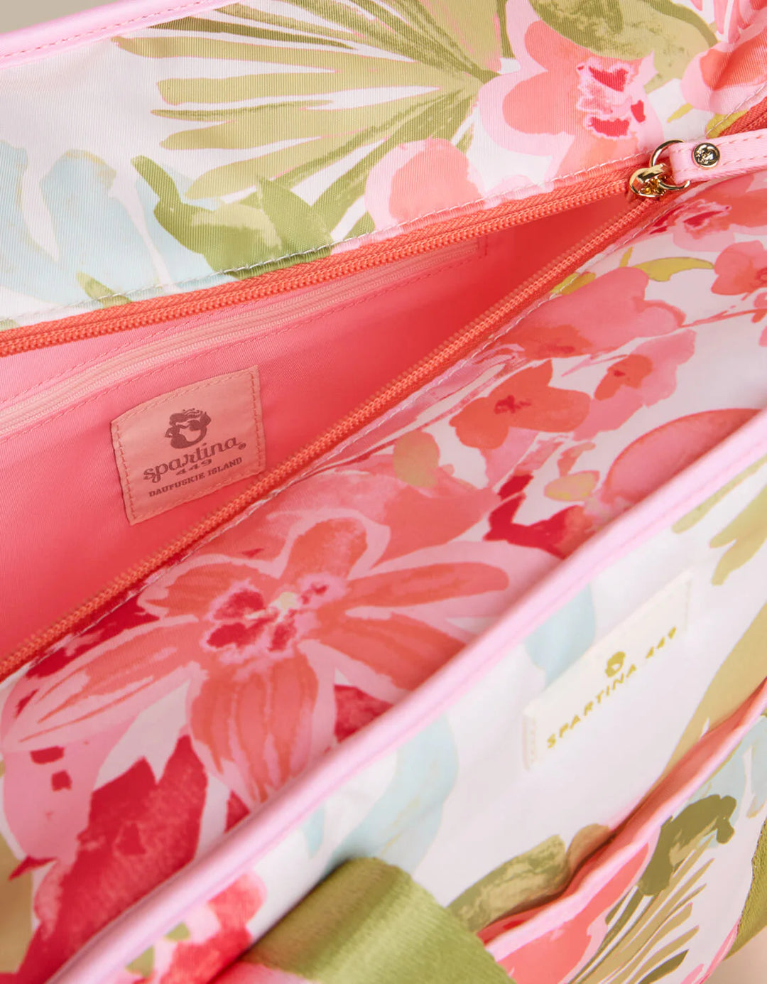 Floral-patterned pouch with a visible brand label on a white background