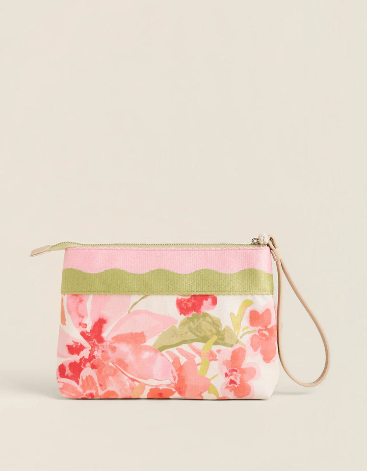 Floral-patterned pouch with a green strap on a beige background
