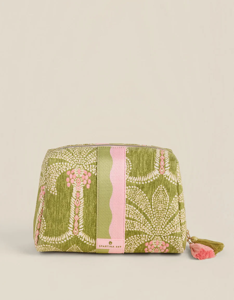 Green and pink patterned pouch on a beige background