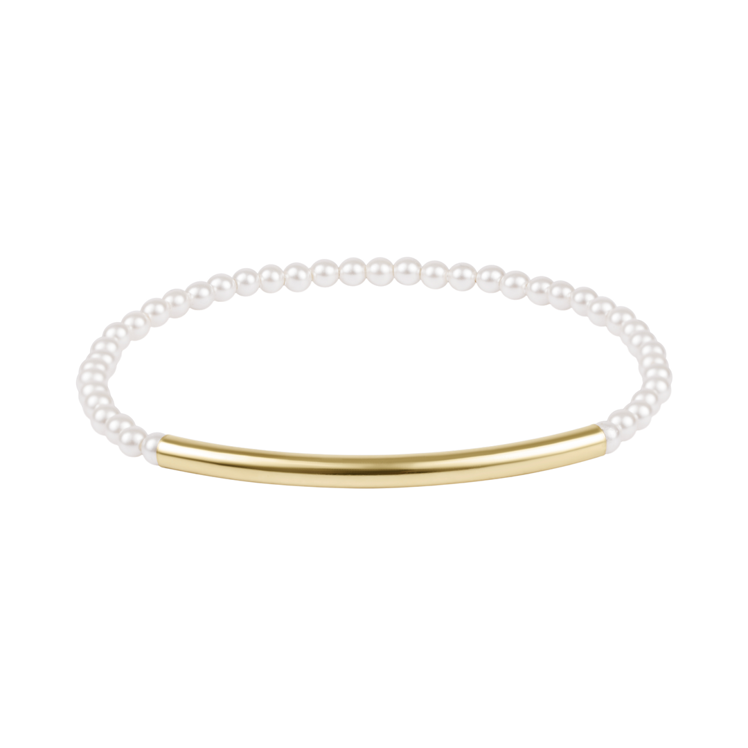 Pearl bracelet with a gold bar on a white background