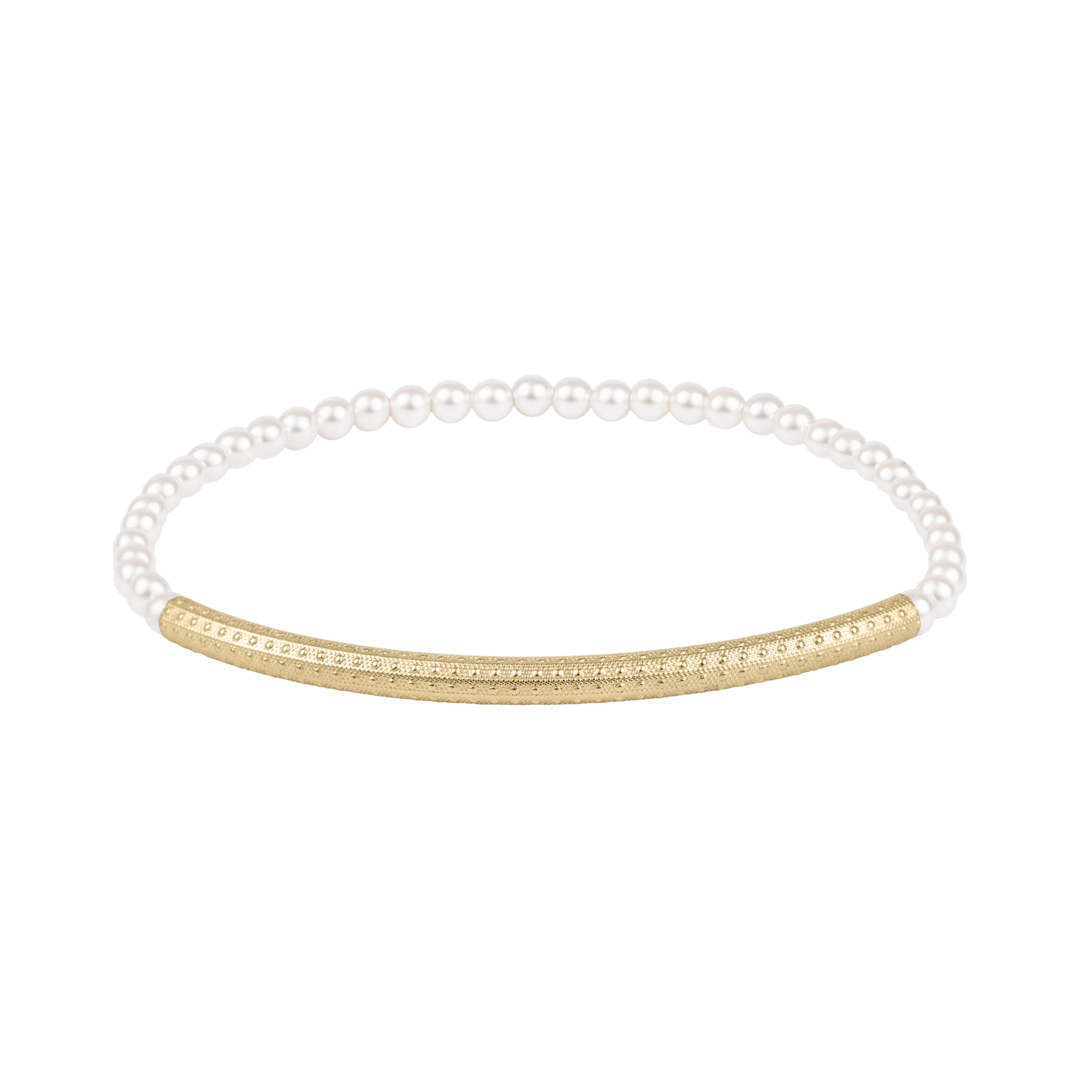 Pearl bracelet with a gold bar on a white background