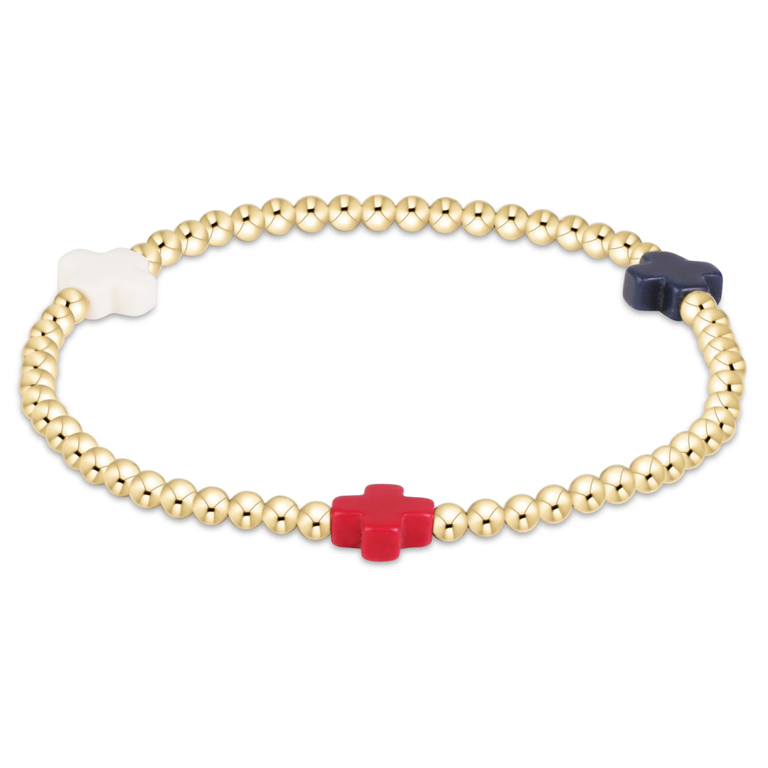 gold beaded bracelet with red white and blue cross beads