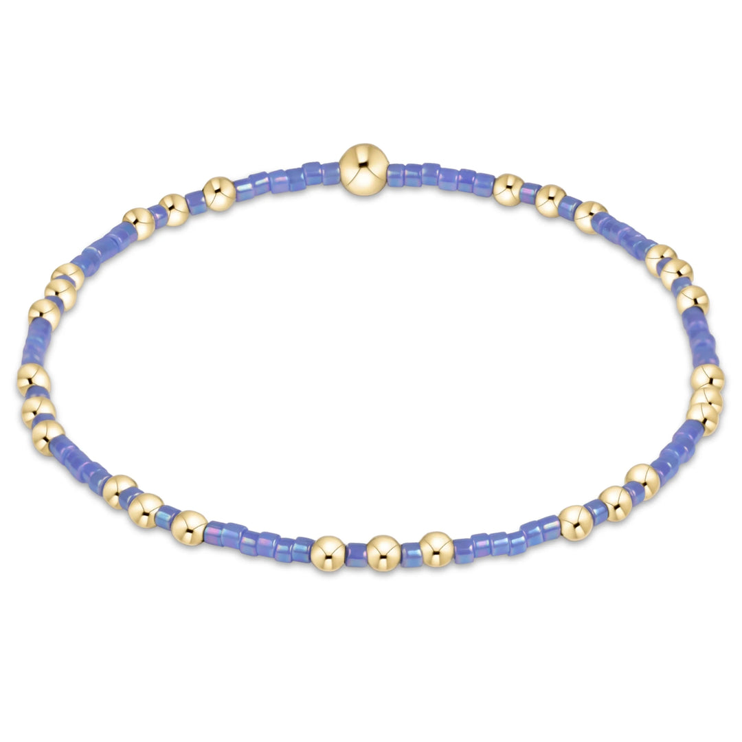 BEADED BLUE BRACELET WITH GOLD ACCENT PIECES