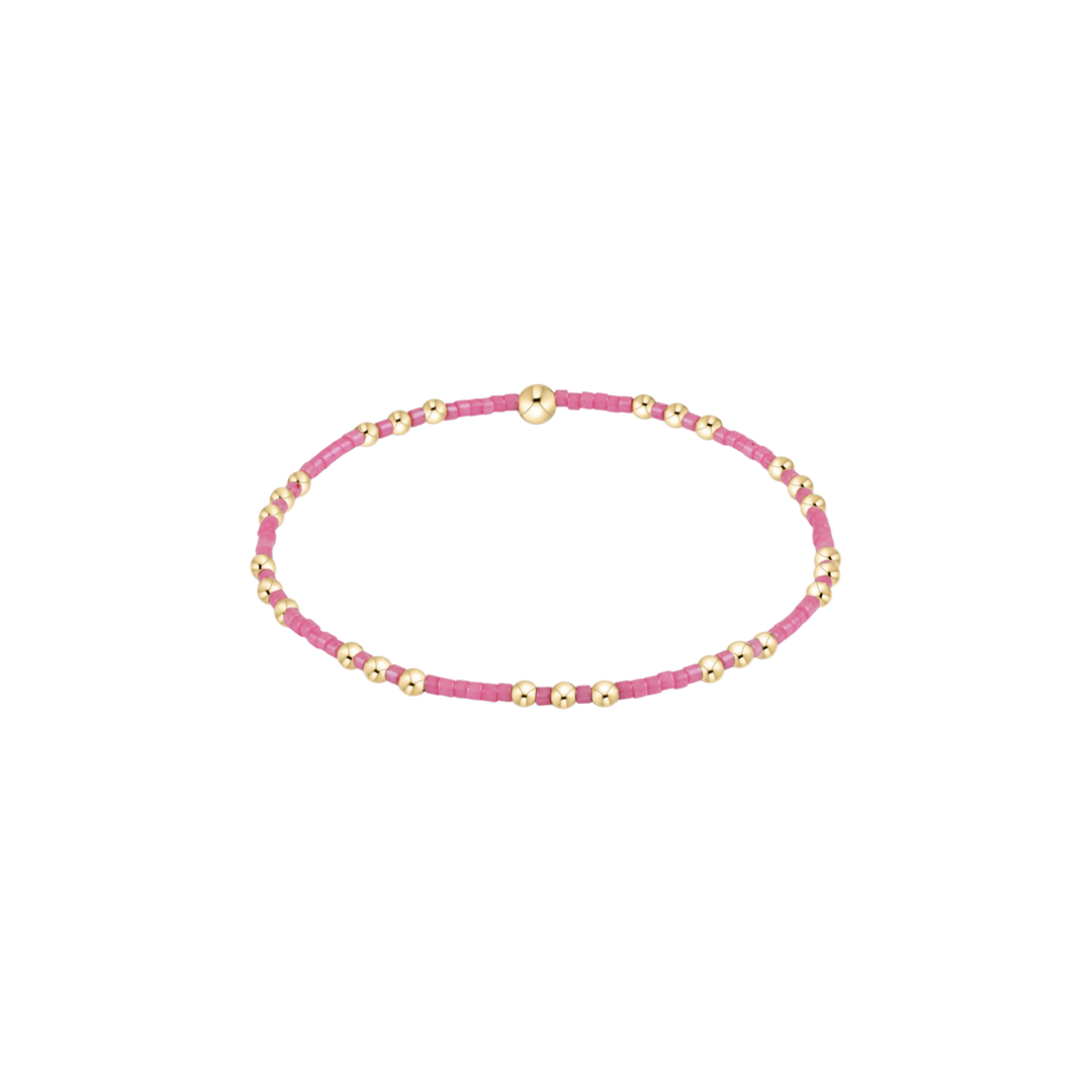 bubblegum pink beaded bracelet with gold accent beads