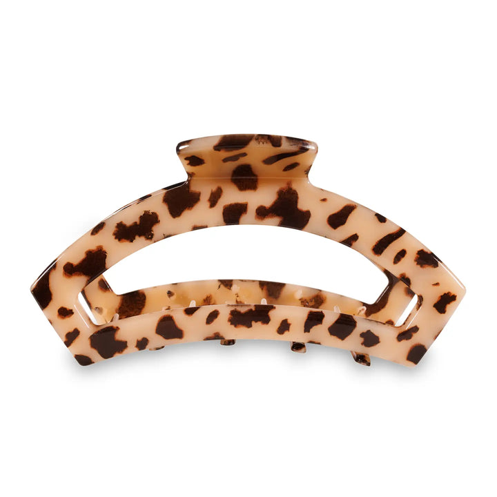 Tortoiseshell patterned hair clip on a white background