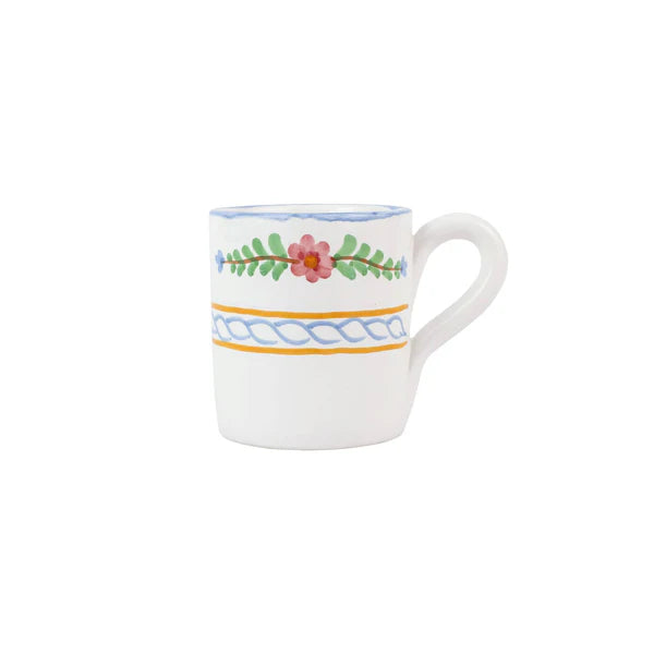 White mug with floral and decorative patterns on a white background
