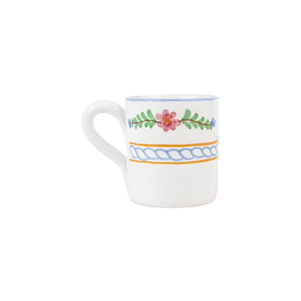 White mug with floral design on a white background