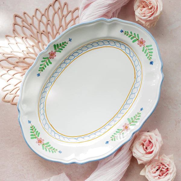 Decorative ceramic plate with floral patterns on a light background