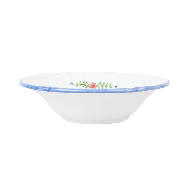 White ceramic bowl with floral design on a white background
