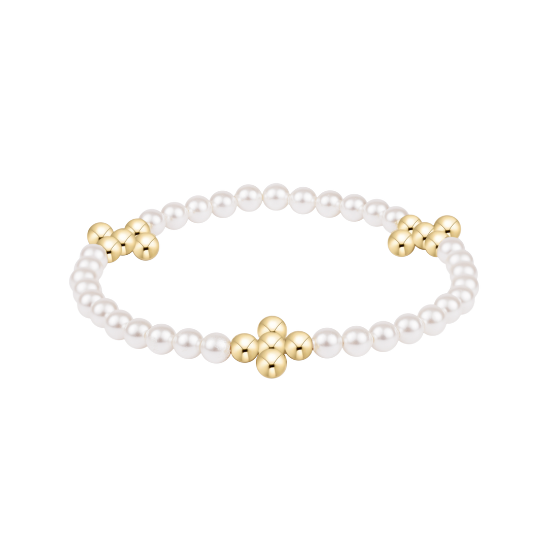 Pearl bracelet with gold clasp on a white background