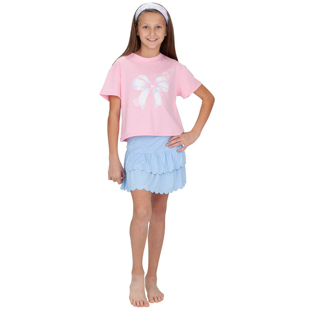 girl wearing athleisure shirt and skort