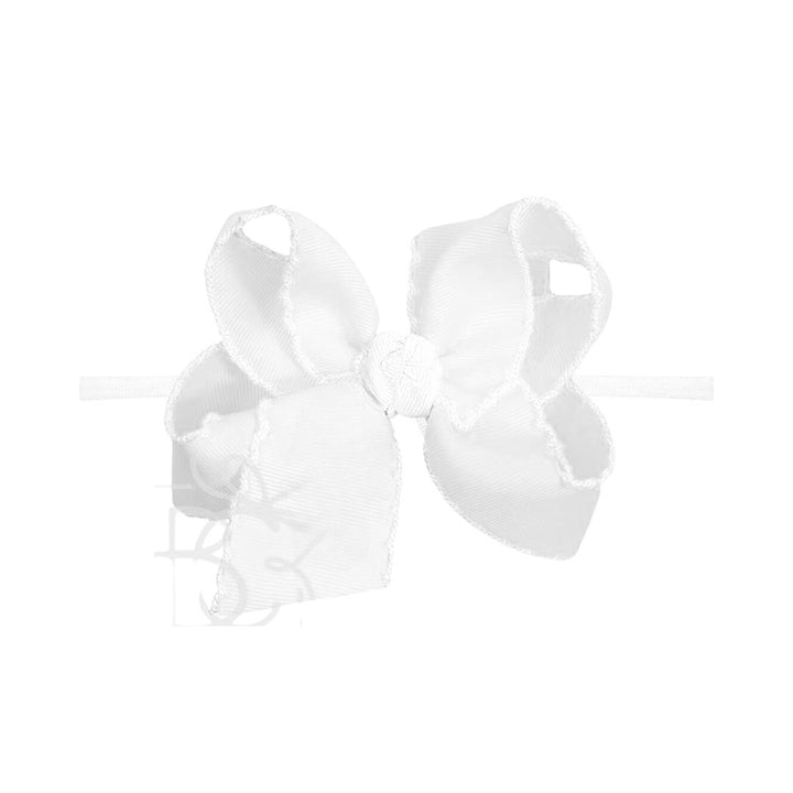 White pantyhose headband with bow on a white background