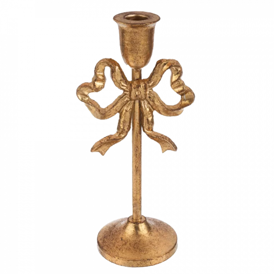 Gold candle holder with bow design on a white background