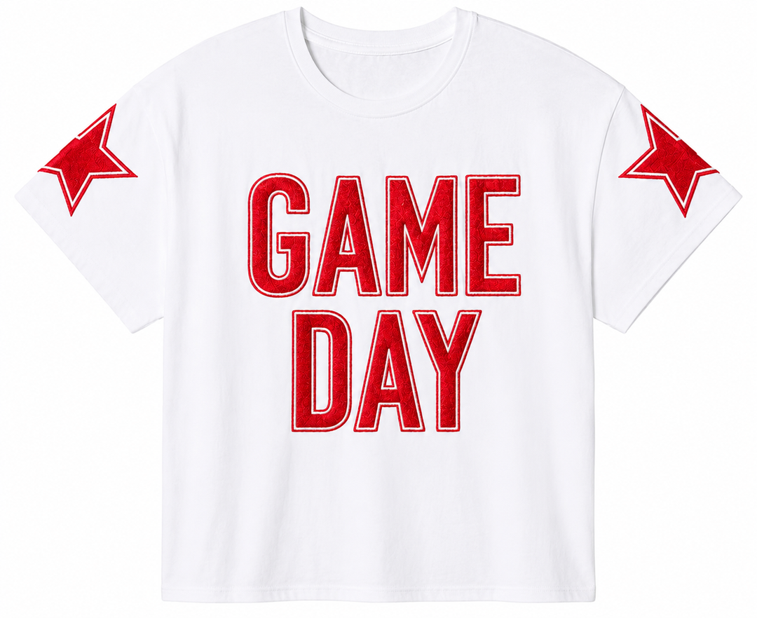White t-shirt with red 'GAME DAY' text and star designs on a white background