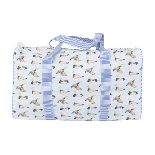 DUFFLE BAG WITH BLUE STRAPS AND MALLARD DUCK PRINT ON BLUE BACKGROUND ON WHITE BACKGROUND