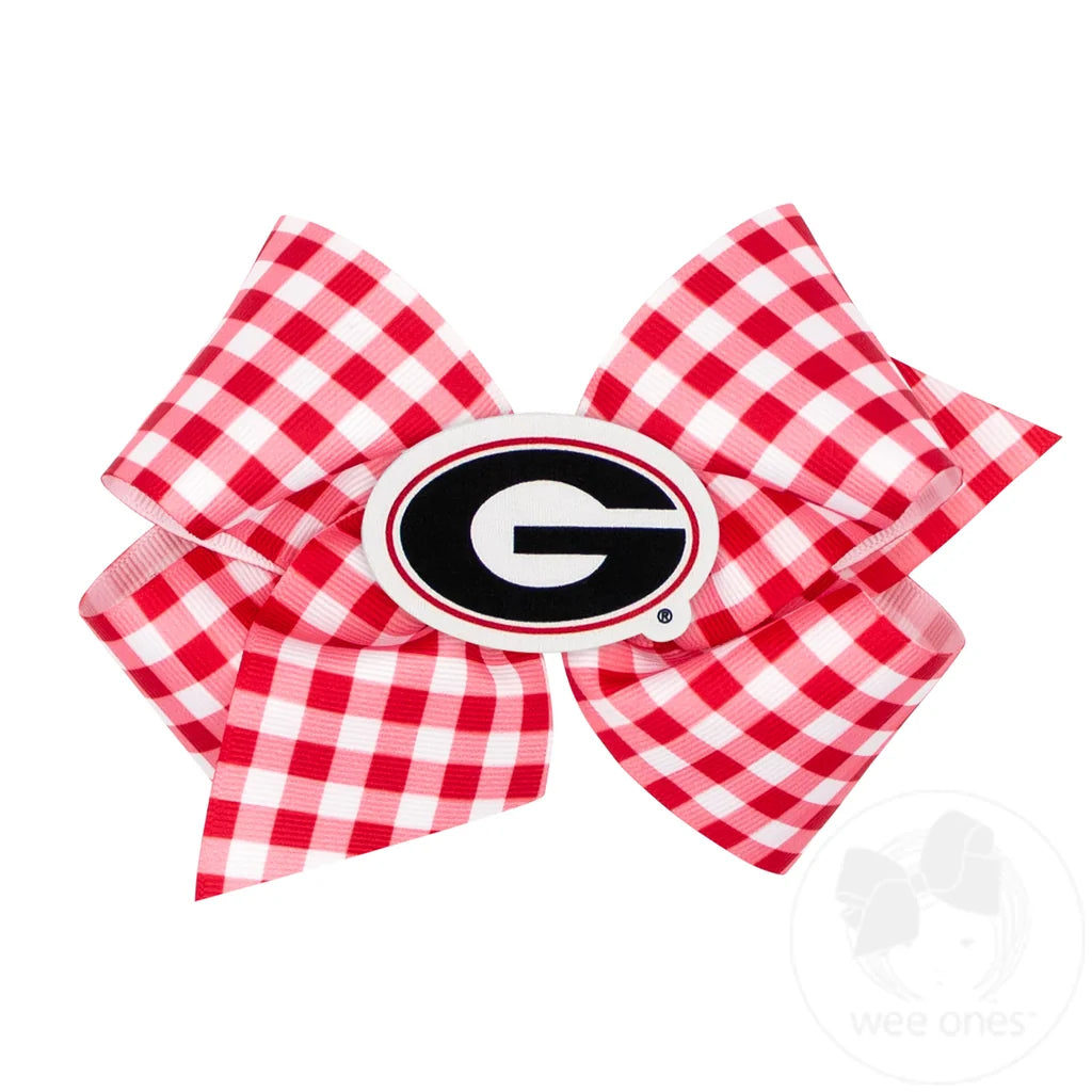 A red and white gingham ribbon hair bow featuring a Georgia Bulldogs logo in the center, set against a plain white background.