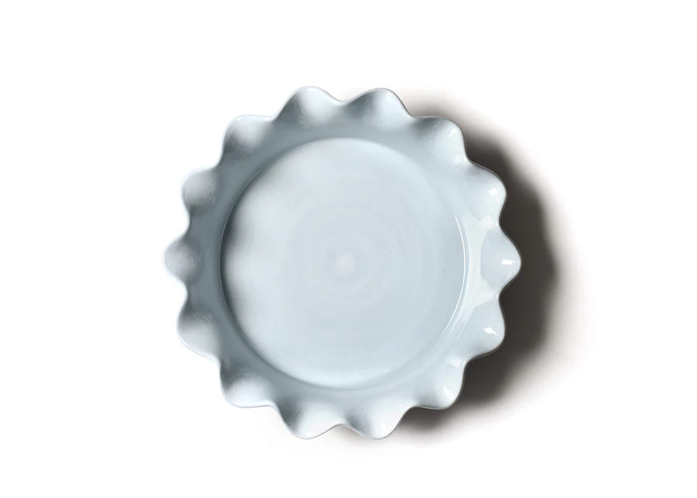 inside of pie dish with ruffle edge and light blue inside
