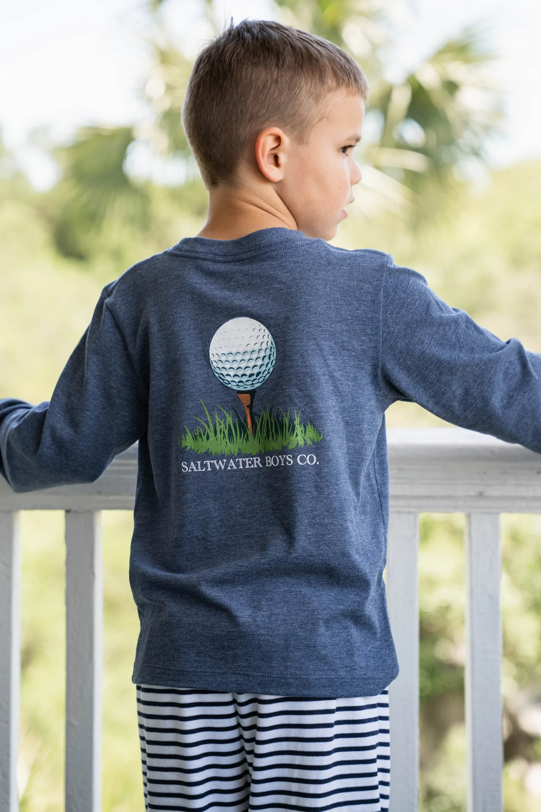 LITTLE BOY WEARING HEATHER BLUE GOLF BALL LONG SLEEVE GRAPHIC TEE