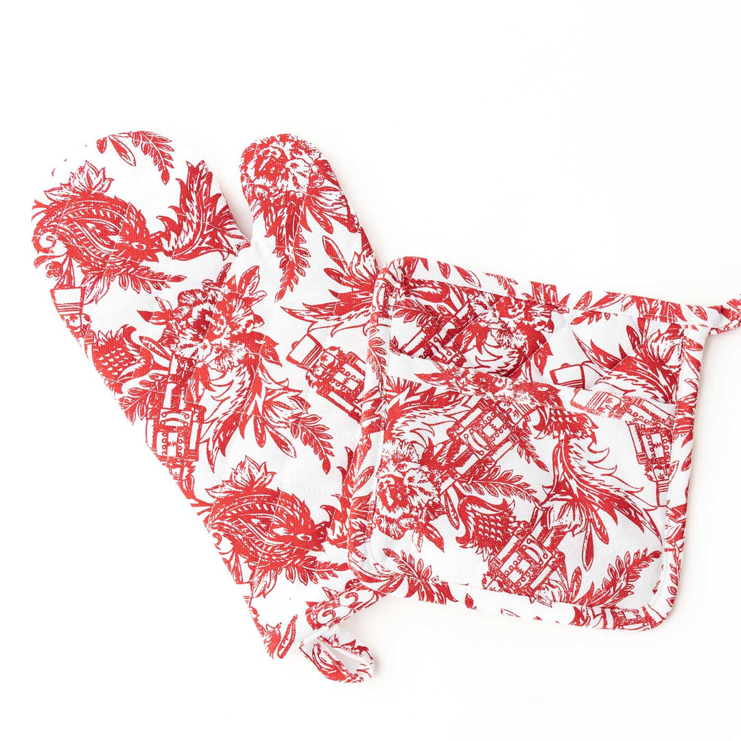Red floral patterned oven mitt on a white background