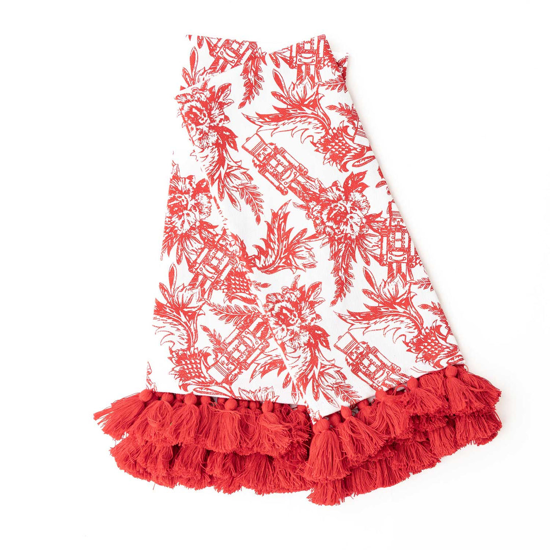 red and white nutcracker pattern on kitchen towel on white background