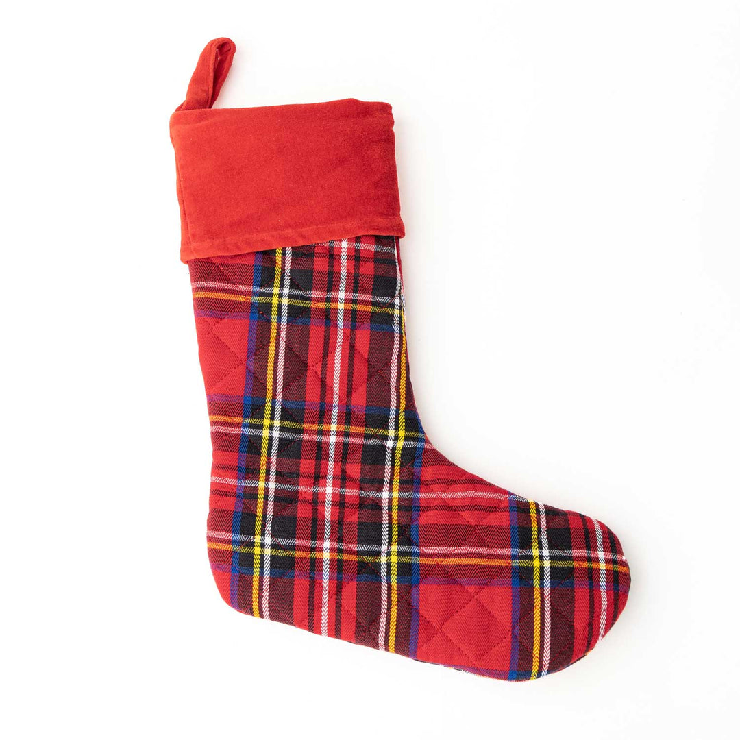 plaid quilted stocking on white background