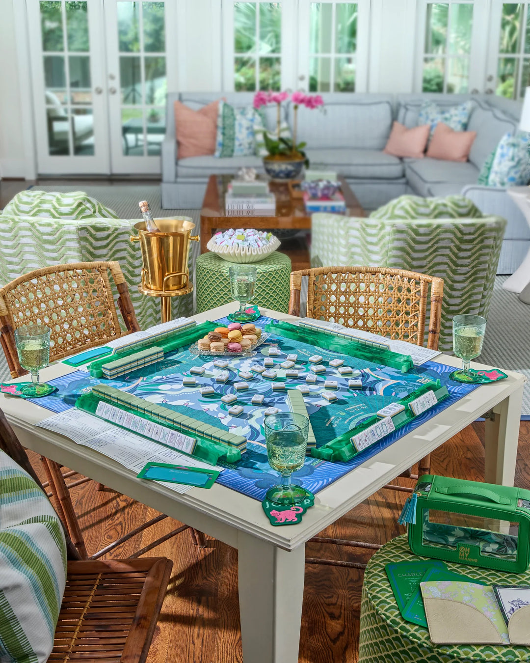 Outdoor patio with a table set for a game, surrounded by chairs and a couch.