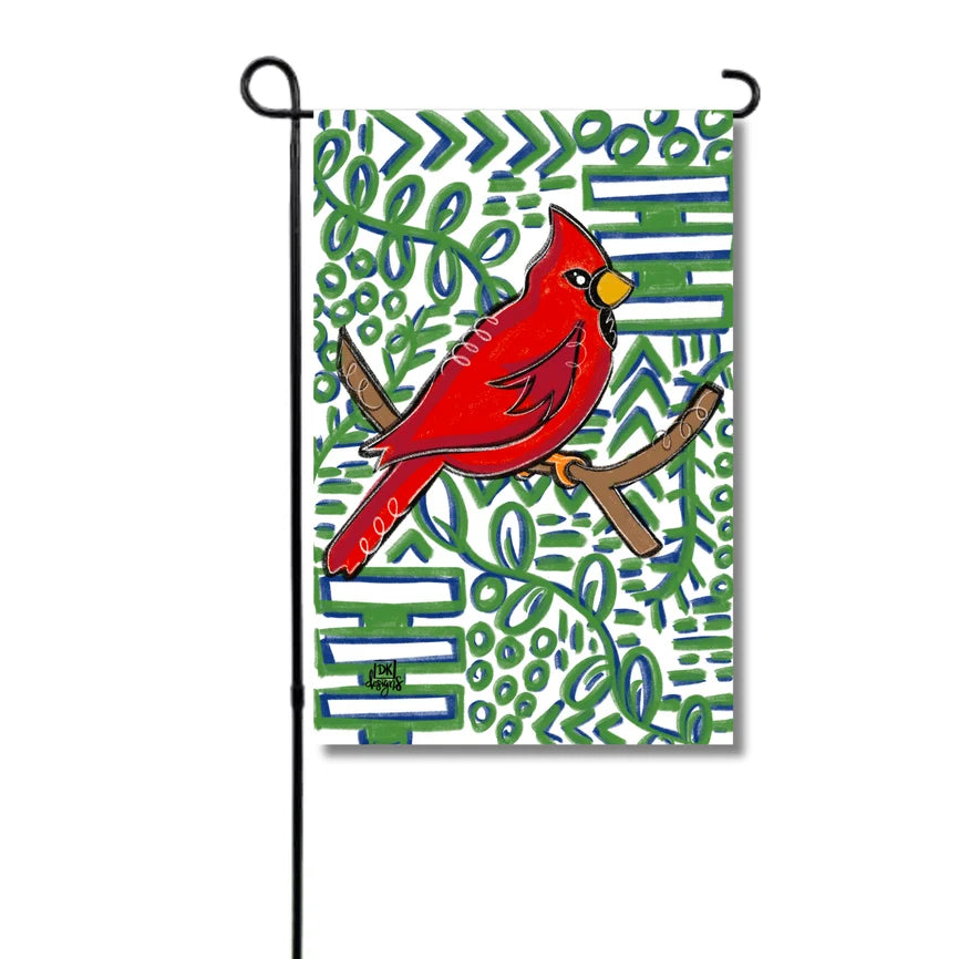 Garden flag with a red cardinal bird on a branch against a colorful geometric pattern