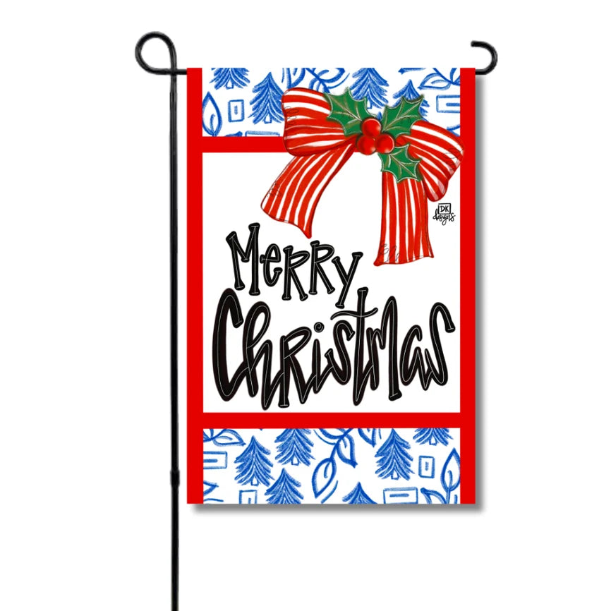 Christmas-themed garden flag with a red border, bow, and trees on a white background.