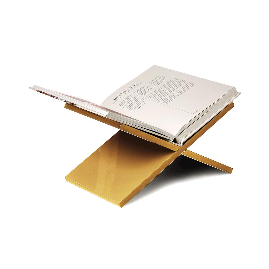 Wooden book stand holding an open book on a white background