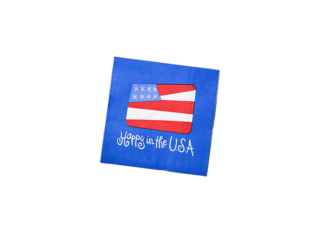 BLUE PAPER NAPKINS WITH "HAPPY IN THE U.S.A" WITH AMERICAN FLAG ON WHITE BACKGROUND