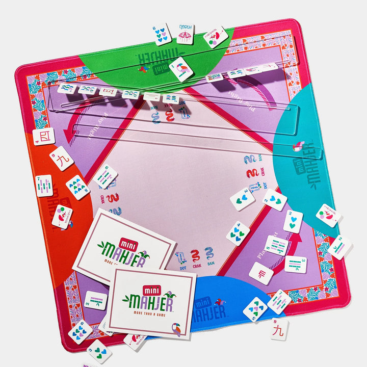 Mini Mahjer game mat with playing tiles, clear racks, and scorecards on a white background. | Walker Boutique