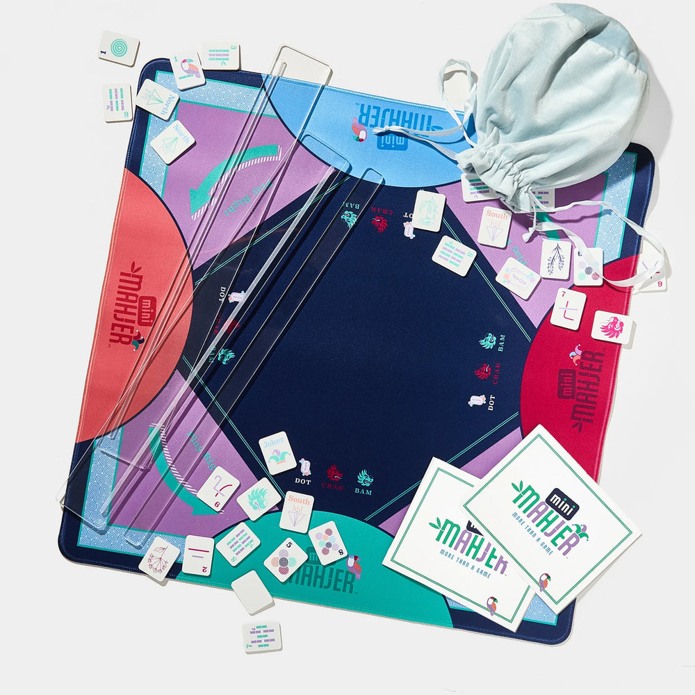 Mini Mahjer game mat with playing tiles, clear racks, scorecards, and storage bag on a white background. | Walker Boutique