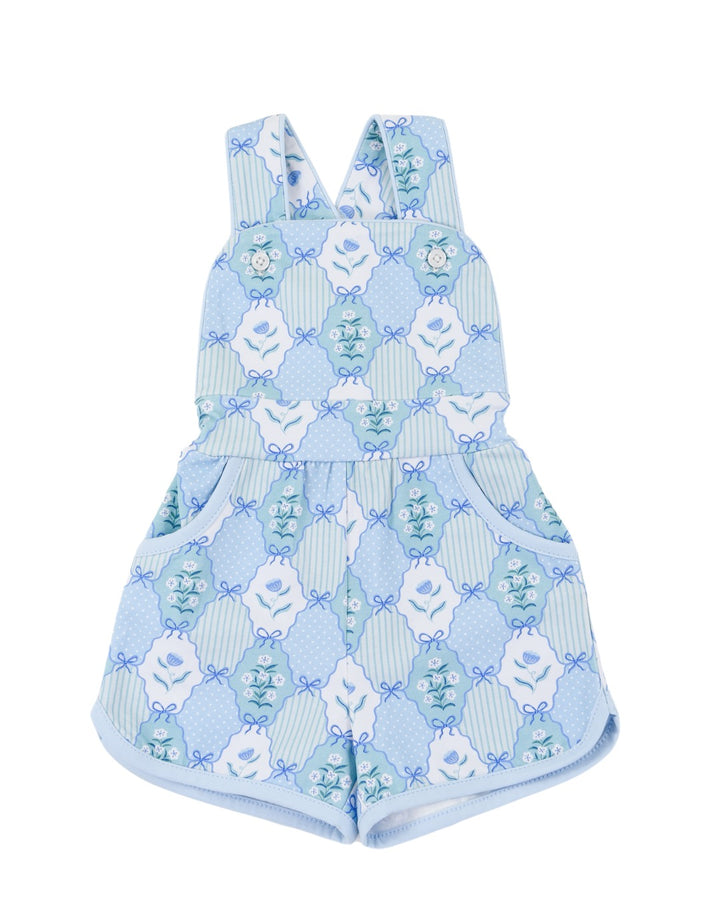 Children's blue patterned romper with white flowers on a white background