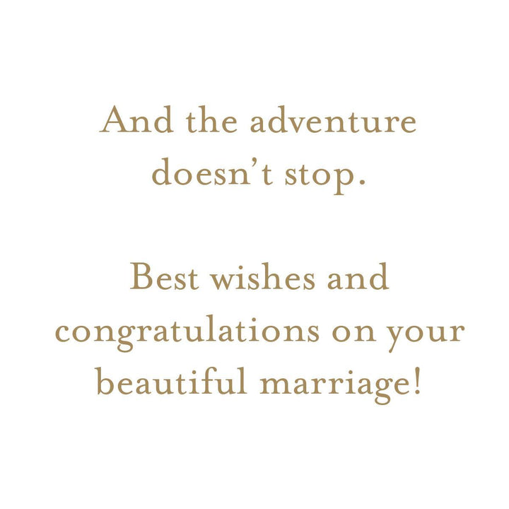 A square white card or print with centered tan serif text reading, 'And the adventure doesn't stop. Best wishes and congratulations on your beautiful marriage!'.
