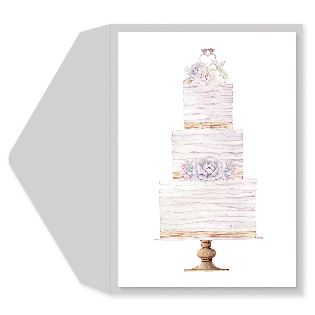 A square greeting card or art print with a white envelope behind it, featuring a watercolor illustration of a three-tiered wedding cake on a stand with floral decorations.