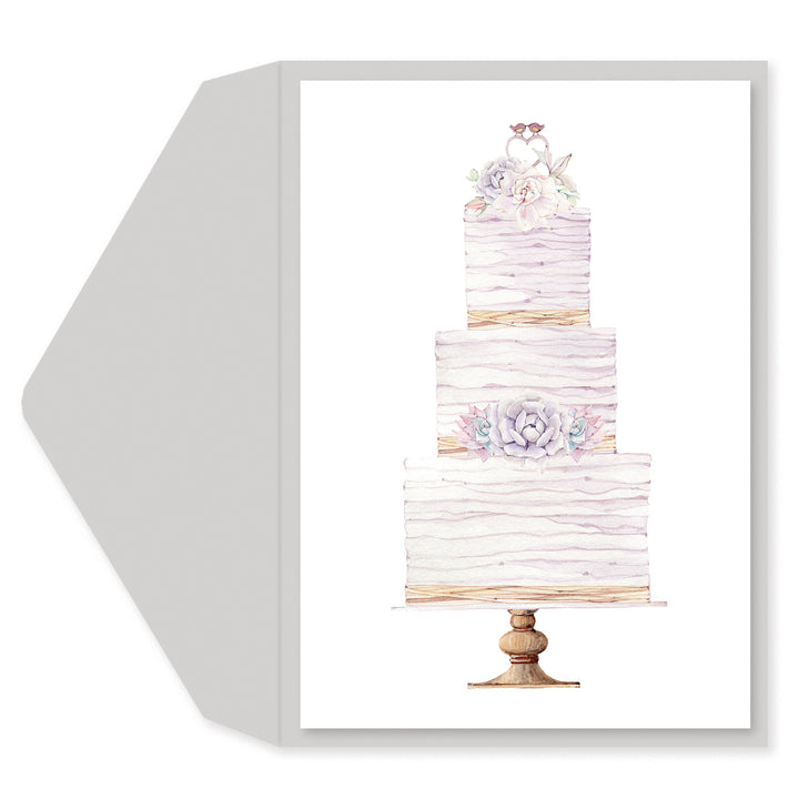 A square greeting card or art print with a white envelope behind it, featuring a watercolor illustration of a three-tiered wedding cake on a stand with floral decorations.