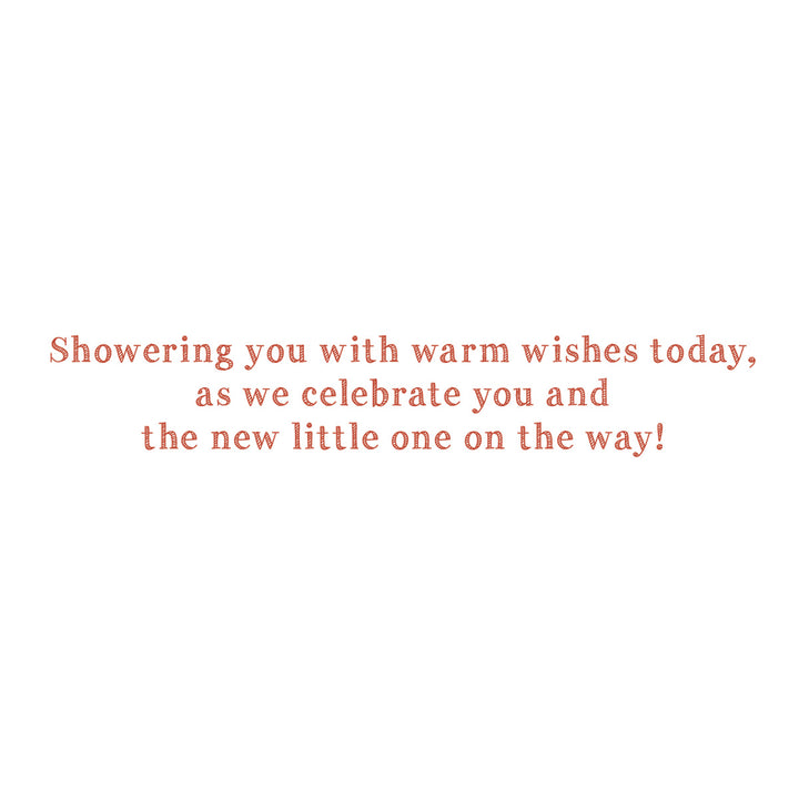 A square white card or print featuring centered coral-red text that reads, 'Showering you with warm wishes today, as we celebrate you and the new little one on the way!'.