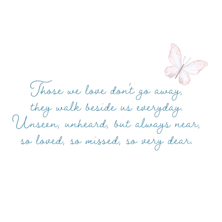 A white wall art print featuring a light blue cursive quote and a soft pink butterfly illustration in the upper right corner.